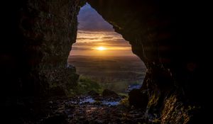 Preview wallpaper cave, sun, sunset, landscape, nature
