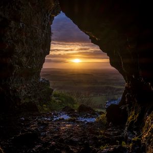 Preview wallpaper cave, sun, sunset, landscape, nature