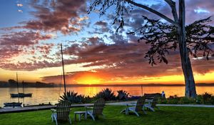 Preview wallpaper chairs, decline, boats, coast, evening, look, sky