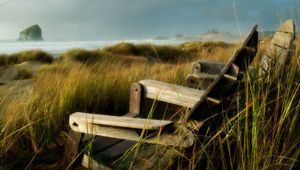 Preview wallpaper chairs, grass, sea, storm, wind