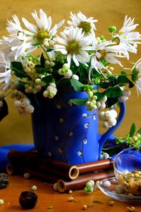 Preview wallpaper chamomile, flowers, pitcher, bouquet, cup, scarf, tea