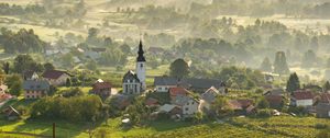 Preview wallpaper chapel, houses, buildings, valley, fog