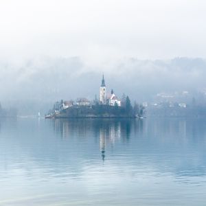 Preview wallpaper chapel, houses, island, lake, fog