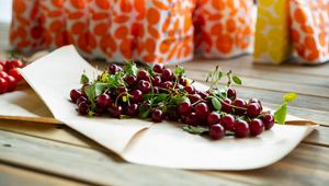 Preview wallpaper cherry, berries, leaves, parchment, macro