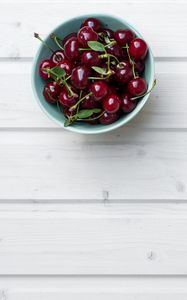 Preview wallpaper cherry, leaves, bowl, wood, white