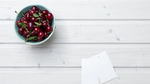Preview wallpaper cherry, leaves, bowl, wood, white