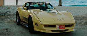 Preview wallpaper chevrolet corvette, chevrolet, car, yellow, retro, beach