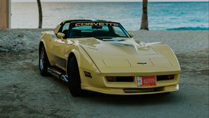 Preview wallpaper chevrolet corvette, chevrolet, car, yellow, retro, beach