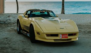 Preview wallpaper chevrolet corvette, chevrolet, car, yellow, retro, beach