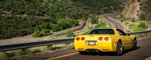 Preview wallpaper chevrolet corvette, chevrolet, car, yellow, back view, road