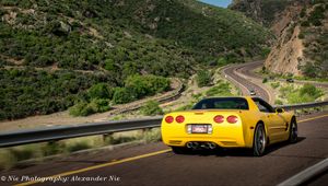 Preview wallpaper chevrolet corvette, chevrolet, car, yellow, back view, road