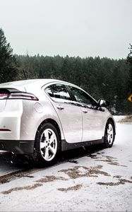 Preview wallpaper chevrolet volt, chevrolet, snowfall, side view, snow