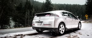 Preview wallpaper chevrolet volt, chevrolet, snowfall, side view, snow