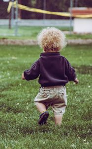 Preview wallpaper child, baby, curly, grass, walk, childhood