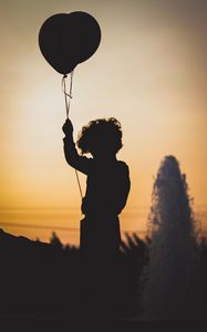 Preview wallpaper child, balloon, silhouette, sunset