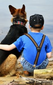 Preview wallpaper child, dog, beach, sand