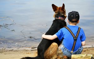 Preview wallpaper child, dog, beach, sand