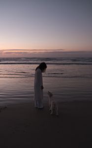 Preview wallpaper child, dog, pet, friends, beach, sunset