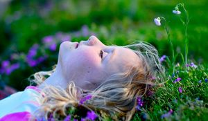 Preview wallpaper child, girl, lying, grass, relax