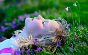 Preview wallpaper child, girl, lying, grass, relax