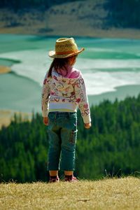 Preview wallpaper child, grass, hills, walking, nature, forest