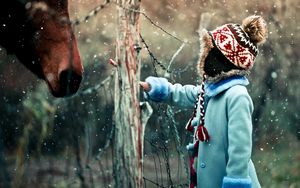Preview wallpaper child, horse, winter, snow, curiosity
