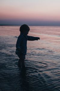 Preview wallpaper child, kid, childhood, sea, sunset