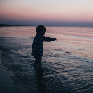 Preview wallpaper child, kid, childhood, sea, sunset