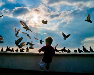 Preview wallpaper child, pigeons, birds, flying, hobby
