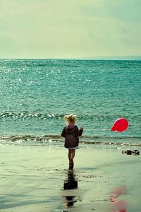 Preview wallpaper child, sea, ball, sand, walk