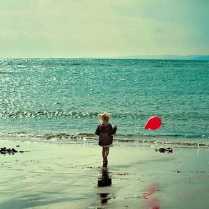 Preview wallpaper child, sea, ball, sand, walk