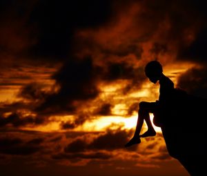 Preview wallpaper child, silhouette, cliff, think, sky, clouds