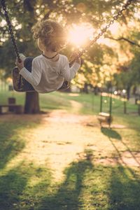 Preview wallpaper child, swing, sun, sunlight, summer