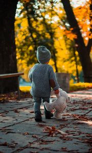 Preview wallpaper child, teddy bear, autumn, walk