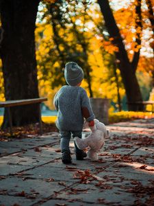 Preview wallpaper child, teddy bear, autumn, walk