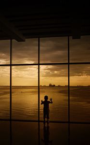 Preview wallpaper child, window, silhouette, sea, clouds, sunset