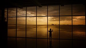 Preview wallpaper child, window, silhouette, sea, clouds, sunset