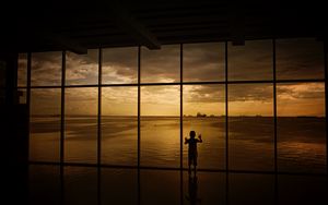 Preview wallpaper child, window, silhouette, sea, clouds, sunset