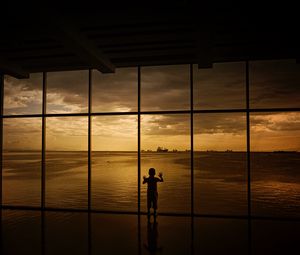 Preview wallpaper child, window, silhouette, sea, clouds, sunset