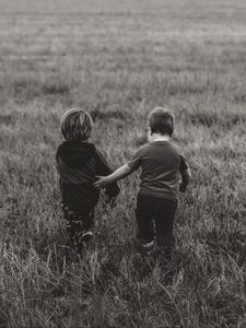 Preview wallpaper children, couple, field, walk, friendship, bw