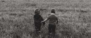 Preview wallpaper children, couple, field, walk, friendship, bw