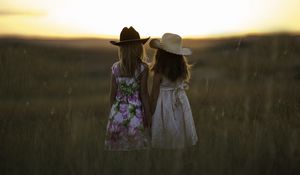 Preview wallpaper children, field, girls, sisters, grass