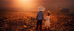 Preview wallpaper children, sunset, grass, sky