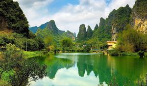 Preview wallpaper china, pond, coast, water, surface, mountains, woods