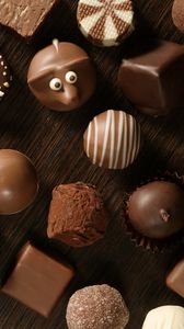 Preview wallpaper chocolate, candies, table, allsorts, eyes