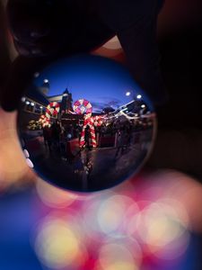 Preview wallpaper christmas ball, reflection, garlands, decorations, people, new year, christmas