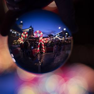 Preview wallpaper christmas ball, reflection, garlands, decorations, people, new year, christmas