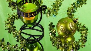 Preview wallpaper christmas decorations, balloon, stones, candle, candlestick, green background