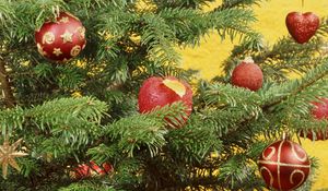 Preview wallpaper christmas, new year, fur-tree, attribute, spheres, red, ornaments, heart