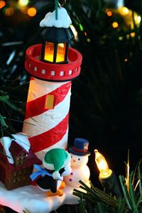 Preview wallpaper christmas tree, garlands, house, lighthouse, penguin, snowman, figurines, holiday